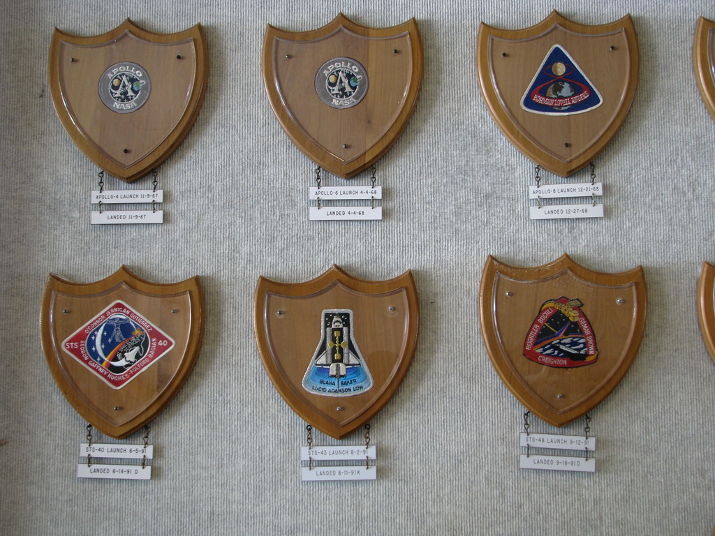 Close-up of some of the mission patches and launch/landing dates. Apollo 8's logo is one of my favourites.