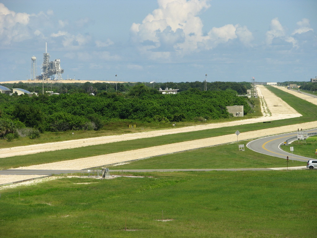 View onto Launch Complex 39(A?) with structures from the Space Shuttle era. I vividly remember the first time I saw these memorable structures (on LC-39B) during and after the Space Shuttle Discovery's STS-26 Return to Flight launch in 1988, which I taped and followed as a child.