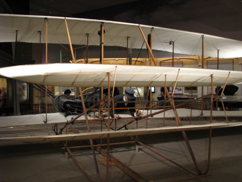 The Wright Flyer, with original wooden parts, the first successful heavier-than-air aircraft. This very plane took the Wright Brothers on their pioneering flight near Kitty Hawk in 1903.