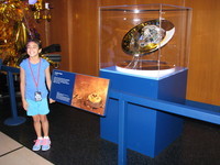 A 1:4 scale model of Huygens; judging by her enthuiasm, this girl might be a serious space geek and future JPL star.