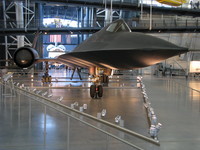 The Udvar-Hazy center's SR-71 Blackbird from up close, with the Space Shuttle Discovery in the background.