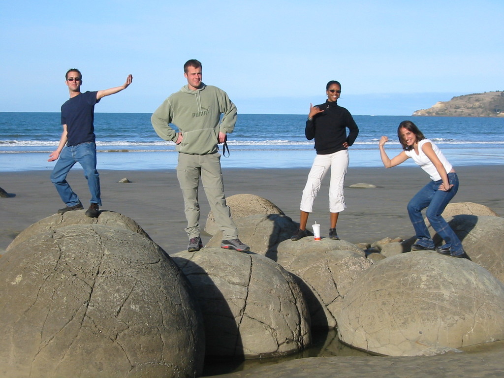 Posing on the Moeraki Boulders; from left to right: Tobias, Nicolas, Nafi, Naila. The McDonalds cup subtly compromises the picture's inherent coolness, though.