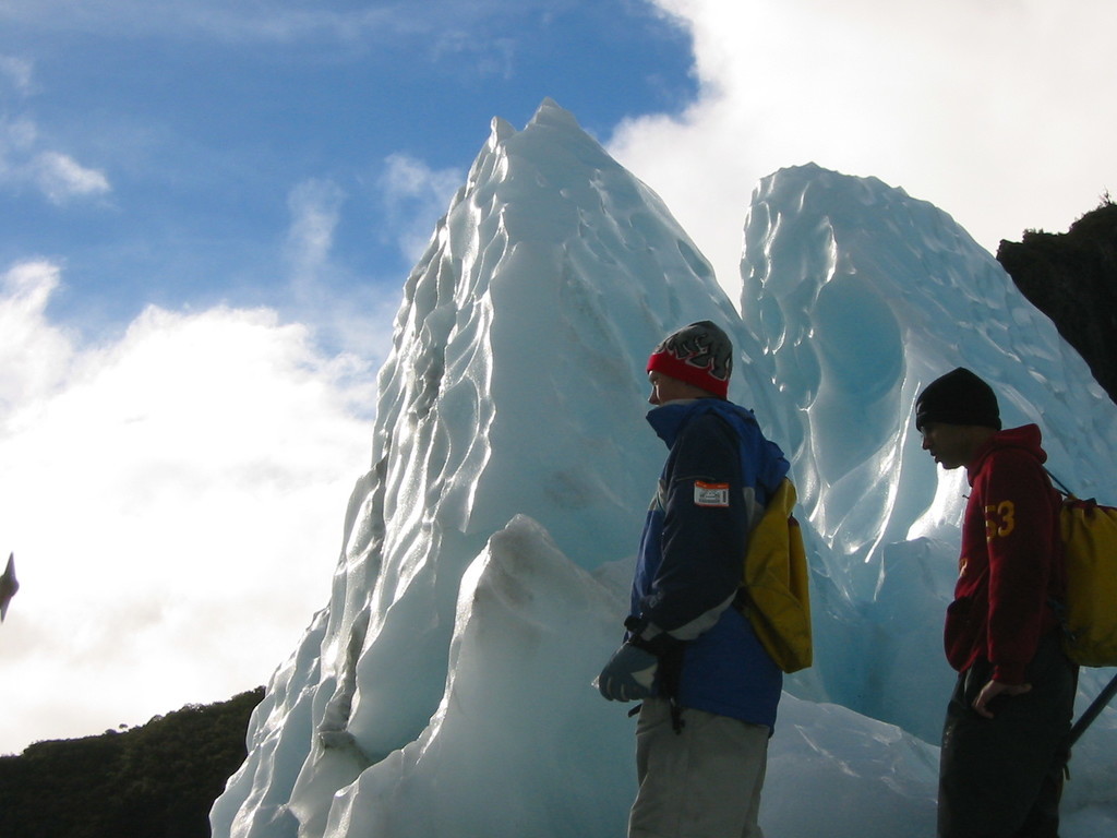 Luke and Tarpan, in front of two icy pillars